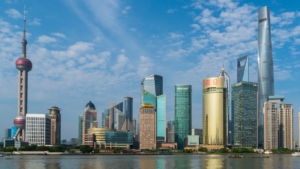 Shanghai skyline representing Asia ex-Japan equities as regional markets break higher and the AAXJ ETF approaches record highs