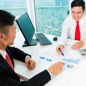 A man engaged in detailed financial consultation with an advisor in a modern office within a bustling business district in Singapore. The advisor, using a pen, is pointing to a chart printed on paper, representing an in-depth analysis of financial trends and strategies, a key step in ensuring a comprehensive personal financial health check.