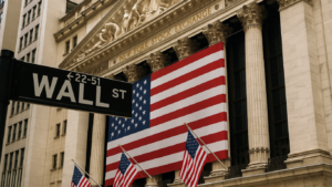 Wall Street sign and New York Stock Exchange with a large U.S. flag—context for US equities outlook amid FOMC market reaction to a Fed rate cut and December odds, with references to an S&P 500 weekly chart.